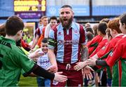 12 April 2024; Drogheda United captain Gary Deegan leads his side out before the SSE Airtricity Men's Premier Division match between Drogheda United and Derry City at Weavers Park in Drogheda, Louth. Photo by Ramsey Cardy/Sportsfile