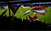 12 April 2024; Drogheda United supporters wave flags during the SSE Airtricity Men's Premier Division match between Drogheda United and Derry City at Weavers Park in Drogheda, Louth. Photo by Ramsey Cardy/Sportsfile