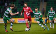 12 April 2024; Connor Malley of Sligo Rovers in action against Shamrock Rovers players Darragh Nugent, right, and Daniel Cleary during the SSE Airtricity Men's Premier Division match between Shamrock Rovers and Sligo Rovers at Tallaght Stadium in Dublin. Photo by Seb Daly/Sportsfile