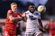 12 April 2024; James Akintunde of Bohemians in action against Gavin Molloy of Shelbourne during the SSE Airtricity Men's Premier Division match between Shelbourne and Bohemians at Tolka Park in Dublin. Photo by Stephen McCarthy/Sportsfile
