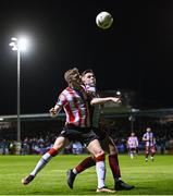 12 April 2024; Ronan Boyce of Derry City in action against Warren Davis of Drogheda United during the SSE Airtricity Men's Premier Division match between Drogheda United and Derry City at Weavers Park in Drogheda, Louth. Photo by Ramsey Cardy/Sportsfile