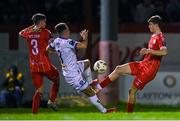 12 April 2024; Dayle Rooney of Bohemians tackles Will Jarvis of Shelbourne, right, resulting in a penalty being awarded for Shelbourne during the SSE Airtricity Men's Premier Division match between Shelbourne and Bohemians at Tolka Park in Dublin. Photo by Stephen McCarthy/Sportsfile