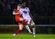 12 April 2024; James Akintunde of Bohemians in action against Gavin Molloy of Shelbourne during the SSE Airtricity Men's Premier Division match between Shelbourne and Bohemians at Tolka Park in Dublin. Photo by Stephen McCarthy/Sportsfile