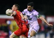 12 April 2024; Jordan Flores of Bohemians in action against John Martin of Shelbourne during the SSE Airtricity Men's Premier Division match between Shelbourne and Bohemians at Tolka Park in Dublin. Photo by Stephen McCarthy/Sportsfile