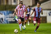 12 April 2024; Adam O'Reilly of Derry City in action against Darragh Markey of Drogheda United during the SSE Airtricity Men's Premier Division match between Drogheda United and Derry City at Weavers Park in Drogheda, Louth. Photo by Ramsey Cardy/Sportsfile