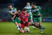 12 April 2024; Connor Malley of Sligo Rovers in action against Shamrock Rovers players Darragh Burns, left, and Dylan Watts during the SSE Airtricity Men's Premier Division match between Shamrock Rovers and Sligo Rovers at Tallaght Stadium in Dublin. Photo by Seb Daly/Sportsfile