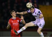 12 April 2024; Jevon Mills of Bohemians in action against Sean Boyd of Shelbourne during the SSE Airtricity Men's Premier Division match between Shelbourne and Bohemians at Tolka Park in Dublin. Photo by Stephen McCarthy/Sportsfile