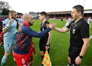 12 April 2024; Referee Paul McLaughlin and Shelbourne captain Mark Coyle before the SSE Airtricity Men's Premier Division match between Shelbourne and Bohemians at Tolka Park in Dublin. Photo by Stephen McCarthy/Sportsfile