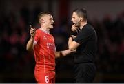 12 April 2024; JJ Lunney of Shelbourne and referee Paul McLaughlin during the SSE Airtricity Men's Premier Division match between Shelbourne and Bohemians at Tolka Park in Dublin. Photo by Stephen McCarthy/Sportsfile