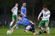 12 April 2024; Niall Holohan of UCD is tackled by Evan McLaughlin of Cork City during the SSE Airtricity Men's First Division match between UCD and Cork City at UCD Bowl in Belfield, Dublin. Photo by Shauna Clinton/Sportsfile