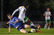 12 April 2024; Jaden Umeh of Cork City is tackled by Ciaran Behan of UCD during the SSE Airtricity Men's First Division match between UCD and Cork City at UCD Bowl in Belfield, Dublin. Photo by Shauna Clinton/Sportsfile