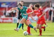 13 April 2024; Melissa O'Kane of Shamrock Rovers in action against Roma McLaughlin and Noelle Murray, right, of Shelbourne during the SSE Airtricity Women's Premier Division match between Shelbourne and Shamrock Rovers at Tolka Park in Dublin. Photo by Stephen McCarthy/Sportsfile