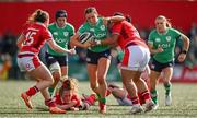 13 April 2024; Katie Corrigan of Ireland is tackled by Abbie Fleming and Sisilia Tuipulotu of Wales during the Women's Six Nations Rugby Championship match between Ireland and Wales at Virgin Media Park in Cork.  Photo by Brendan Moran/Sportsfile