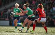 13 April 2024; Enya Breen of Ireland is tackled by Abbie Fleming of Wales during the Women's Six Nations Rugby Championship match between Ireland and Wales at Virgin Media Park in Cork. Photo by Brendan Moran/Sportsfile