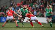 13 April 2024; Sam Monaghan of Ireland is tackled by Abbie Fleming of Wales during the Women's Six Nations Rugby Championship match between Ireland and Wales at Virgin Media Park in Cork.  Photo by Brendan Moran/Sportsfile