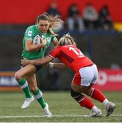 13 April 2024; Béibhinn Parsons of Ireland is tackled by Kerin Lake of Wales during the Women's Six Nations Rugby Championship match between Ireland and Wales at Virgin Media Park in Cork. Photo by Brendan Moran/Sportsfile