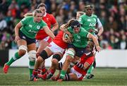 13 April 2024; Brittany Hogan of Ireland is tackled by Georgia Evans of Wales during the Women's Six Nations Rugby Championship match between Ireland and Wales at Virgin Media Park in Cork. Photo by Brendan Moran/Sportsfile