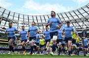 13 April 2024; Leinster captain Caelan Doris leads the team in the warm-up before the Investec Champions Cup quarter-final match between Leinster and La Rochelle at the Aviva Stadium in Dublin. Photo by Harry Murphy/Sportsfile