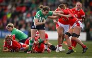 13 April 2024; Eve Higgins of Ireland on the way to scoring her side's second try despite the tackle of Alisha Butchers of Wales during the Women's Six Nations Rugby Championship match between Ireland and Wales at Virgin Media Park in Cork. Photo by Brendan Moran/Sportsfile