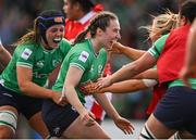 13 April 2024; Eve Higgins of Ireland, centre, celebrates with teammate Brittany Hogan after scoring their side's second try during the Women's Six Nations Rugby Championship match between Ireland and Wales at Virgin Media Park in Cork. Photo by Brendan Moran/Sportsfile