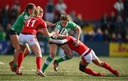 13 April 2024; Eve Higgins of Ireland is tackled by Jasmine Joyce of Wales during the Women's Six Nations Rugby Championship match between Ireland and Wales at Virgin Media Park in Cork. Photo by Brendan Moran/Sportsfile