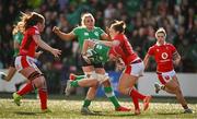 13 April 2024; Aoife Wafer of Ireland is tackled by Jenny Hesketh of Wales during the Women's Six Nations Rugby Championship match between Ireland and Wales at Virgin Media Park in Cork. Photo by Brendan Moran/Sportsfile