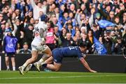 13 April 2024; James Lowe of Leinster scores his side's first try despite the efforts of Jack Nowell of La Rochelle  during the Investec Champions Cup quarter-final match between Leinster and La Rochelle at the Aviva Stadium in Dublin. Photo by Sam Barnes/Sportsfile