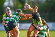 13 April 2024; Ali Bennett of Portdara is tackled by Saoirse Aherne, left, and Eabha Cullen of Naas during the Leinster Rugby Girl's U18 semi-final match between Naas and Portdara at Naas RFC in Kildare. Photo by Tyler Miller/Sportsfile