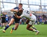 13 April 2024; Jordan Larmour of Leinster in action against Teddy Thomas of La Rochelle during the Investec Champions Cup quarter-final match between Leinster and La Rochelle at the Aviva Stadium in Dublin. Photo by Sam Barnes/Sportsfile