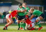 13 April 2024; Christy Haney of Ireland is tackled by Molly Reardon and Abbie Fleming of Wales during the Women's Six Nations Rugby Championship match between Ireland and Wales at Virgin Media Park in Cork. Photo by Brendan Moran/Sportsfile