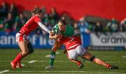13 April 2024; Béibhinn Parsons of Ireland is tackled by Jasmine Joyce and Alex Callender of Wales during the Women's Six Nations Rugby Championship match between Ireland and Wales at Virgin Media Park in Cork.  Photo by Brendan Moran/Sportsfile