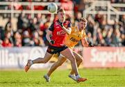 13 April 2024; Liam Kerr of Down in action against Kavan Keenan of Antrim during the Ulster GAA Football Senior Championship quarter-final match between Down and Antrim at Páirc Esler in Newry, Down. Photo by Ben McShane/Sportsfile