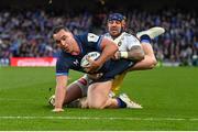 13 April 2024; James Lowe of Leinster dives over to score his side's fifth try despite the tackle of Jack Nowell of La Rochelle during the Investec Champions Cup quarter-final match between Leinster and La Rochelle at the Aviva Stadium in Dublin. Photo by Ramsey Cardy/Sportsfile