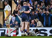 13 April 2024; Dan Sheehan of Leinster celebrates with teammate Jamie Osborne after scoring his side's fourth try  during the Investec Champions Cup quarter-final match between Leinster and La Rochelle at the Aviva Stadium in Dublin. Photo by Harry Murphy/Sportsfile