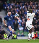 13 April 2024; Robbie Henshaw of Leinster kicks past Levani Botia of La Rochelle to setup his side's fifth try, scored by James Lowe, during the Investec Champions Cup quarter-final match between Leinster and La Rochelle at the Aviva Stadium in Dublin. Photo by Ramsey Cardy/Sportsfile