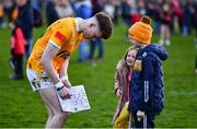 13 April 2024; Conor Hand of Antrim signs autographs for supporters after the Ulster GAA Football Senior Championship quarter-final match between Down and Antrim at Páirc Esler in Newry, Down. Photo by Ben McShane/Sportsfile