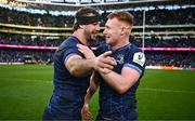 13 April 2024; Caelan Doris and Ciarán Frawley of Leinster after their side's victory in the Investec Champions Cup quarter-final match between Leinster and La Rochelle at the Aviva Stadium in Dublin. Photo by Harry Murphy/Sportsfile