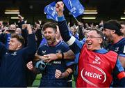 13 April 2024; Ross Byrne of Leinster, centre, and Leinster head of medical Professor John Ryan after his side's victory in the Investec Champions Cup quarter-final match between Leinster and La Rochelle at the Aviva Stadium in Dublin. Photo by Harry Murphy/Sportsfile