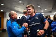 13 April 2024; Joe McCarthy of Leinster and Leinster kicking coach and lead performance analyst Emmet Farrell after their side's victory in the Investec Champions Cup quarter-final match between Leinster and La Rochelle at the Aviva Stadium in Dublin. Photo by Harry Murphy/Sportsfile