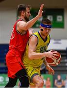 13 April 2024; Tobias Christensen of UCD Marian in action against Karlo Lebo of Moy Tolka Rovers during the InsureMyVan.ie Division 1 play-off final match between UCD Marian and Moy Tolka Rovers at the National Basketball Arena in Tallaght, Dublin. Photo by Tyler Miller/Sportsfile