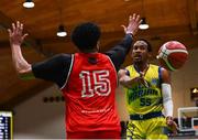 13 April 2024; Jonathon Jean of UCD Marian passes the ball while under pressure from DeWan White of Moy Tolka Rovers during the InsureMyVan.ie Division 1 play-off final match between UCD Marian and Moy Tolka Rovers at the National Basketball Arena in Tallaght, Dublin. Photo by Tyler Miller/Sportsfile
