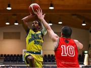 13 April 2024; Jonathon Jean of UCD Marian shoots while under pressure from Elijah Faapito of Moy Tolka Rovers during the InsureMyVan.ie Division 1 play-off final match between UCD Marian and Moy Tolka Rovers at the National Basketball Arena in Tallaght, Dublin. Photo by Tyler Miller/Sportsfile