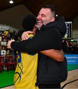 13 April 2024; UCD Marian head coach Ioannis Liapakis celebrates with Jonathon Jean of UCD Marian after the InsureMyVan.ie Division 1 play-off final match between UCD Marian and Moy Tolka Rovers at the National Basketball Arena in Tallaght, Dublin. Photo by Tyler Miller/Sportsfile
