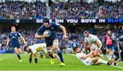 13 April 2024; Ryan Baird of Leinster on his way to scoring his side's third try during the Investec Champions Cup quarter-final match between Leinster and La Rochelle at the Aviva Stadium in Dublin. Photo by Ramsey Cardy/Sportsfile