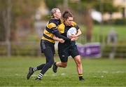 14 April 2024; Lucy Mangan of Garda is tackled by Sophie Murphy of Newbridge during the Women's Division 5 Plate final match between Newbridge and Garda during the Bank of Ireland Leinster Rugby Women Finals Day at Balbriggan RFC in Dublin. Photo by Ben McShane/Sportsfile