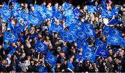 13 April 2024; Supporters wave Leinster flags during the Investec Champions Cup quarter-final match between Leinster and La Rochelle at the Aviva Stadium in Dublin. Photo by Ramsey Cardy/Sportsfile