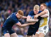 13 April 2024; Jamie Osborne of Leinster, supported by teammate Ciarán Frawley, is tackled by Ihaia West of La Rochelle during the Investec Champions Cup quarter-final match between Leinster and La Rochelle at the Aviva Stadium in Dublin. Photo by Harry Murphy/Sportsfile