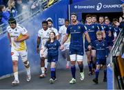 13 April 2024; Leinster captain Caelan Doris walks out with Matchday mascots Avery Tuite and Daragh De Búrca before the Investec Champions Cup quarter-final match between Leinster and La Rochelle at the Aviva Stadium in Dublin. Photo by Harry Murphy/Sportsfile