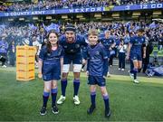 13 April 2024; Leinster captain Caelan Doris walks out with Matchday mascots Avery Tuite and Daragh De Búrca before the Investec Champions Cup quarter-final match between Leinster and La Rochelle at the Aviva Stadium in Dublin. Photo by Harry Murphy/Sportsfile