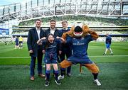 13 April 2024; Matchday mascot Avery Tuite with Leinster players Rob Russell, Scott Penny, Tommy O'Brien and Leo the Lion before the Investec Champions Cup quarter-final match between Leinster and La Rochelle at the Aviva Stadium in Dublin. Photo by Harry Murphy/Sportsfile